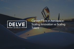 Delve Search blog header featuring a small aircraft parked on an airport apron at sunset, with its cockpit door raised and warm sunlight shining through the cabin. The Delve Search logo appears on the left, while white text on the right reads: “Carbon Fibre in Aerospace: Scaling Innovation vs Scaling Talent.” The image highlights the growing use of advanced composite materials in aerospace and the workforce challenges associated with scaling manufacturing and innovation across the industry.